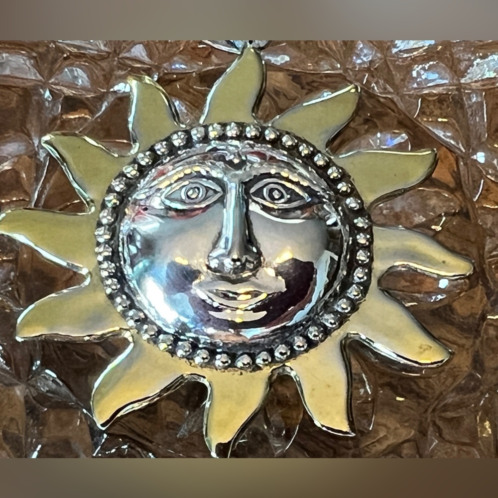 Sunburst with face 925 Sterling pendant.